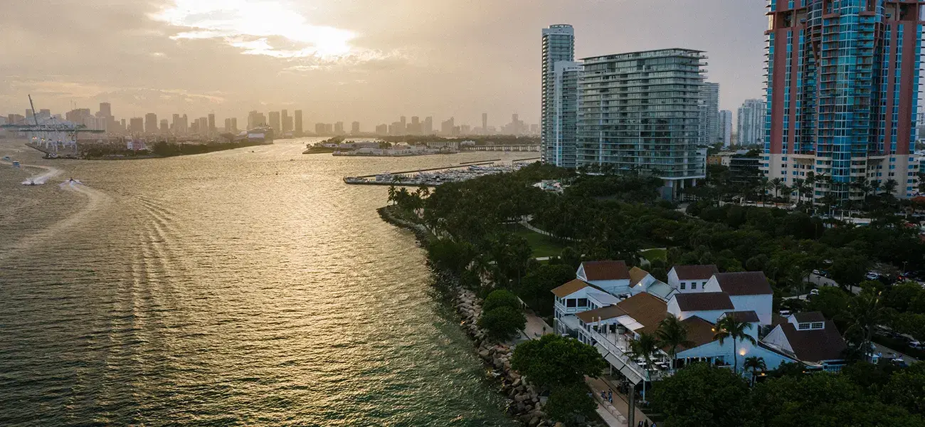 Biscayne Bay at sunset with waterfront homes and towers
