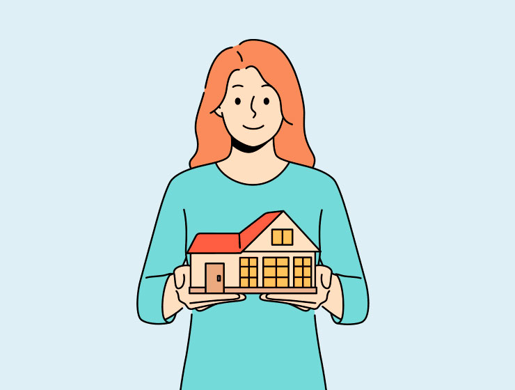 Real estate expert holding a house model for home valuation services by Alejandro Bernal